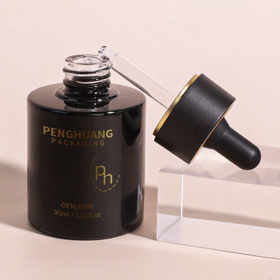 Ronde glazen druppelfles met aangepast logo volgens klantvereisten