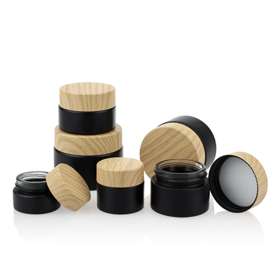 Het kosmetische Verpakkende Vastgestelde Schroefdeksel Zwart Matte Glass Jars 50g van de Bamboekleur