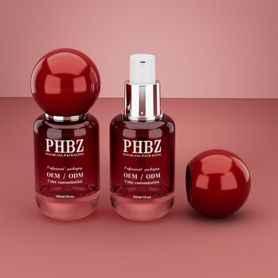 30 ml / 1 oz lege rode hellingsglas cosmetische serumfles met ronde bolkap, aangepaste kleur OEM ODM huidverzorging verpakking voor lotion essentiële olie